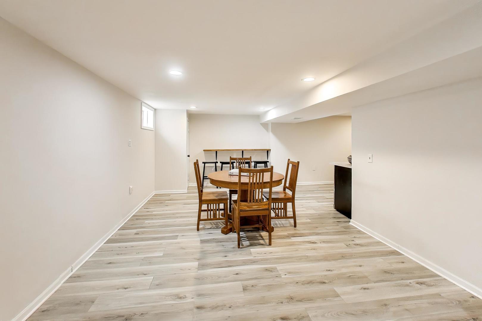 1445 Stoddard Avenue Wheaton, IL 60187 - Photo 31 of 38 a view of a dining room with furniture and a table