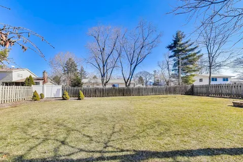 a view of a swimming pool with an outdoor space and seating area