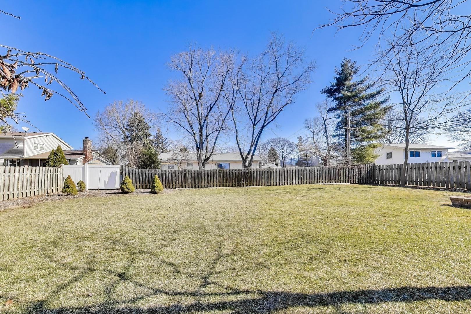 1445 Stoddard Avenue Wheaton, IL 60187 - Photo 33 of 38 a view of a swimming pool with an outdoor space and seating area