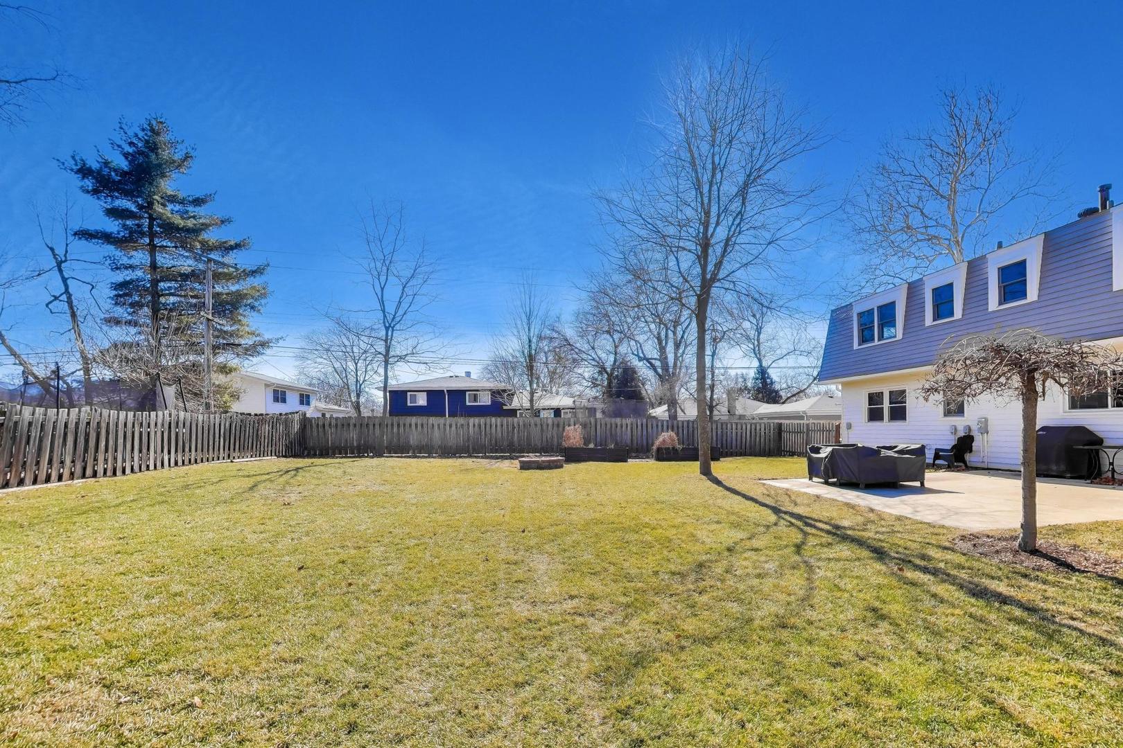 1445 Stoddard Avenue Wheaton, IL 60187 - Photo 34 of 38 a view of a swimming pool with an outdoor seating