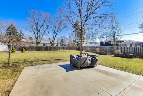 a view of swimming pool with garden and trees