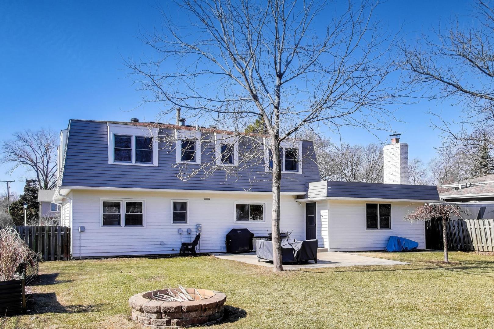 1445 Stoddard Avenue Wheaton, IL 60187 - Photo 37 of 38 a front view of a house with a yard