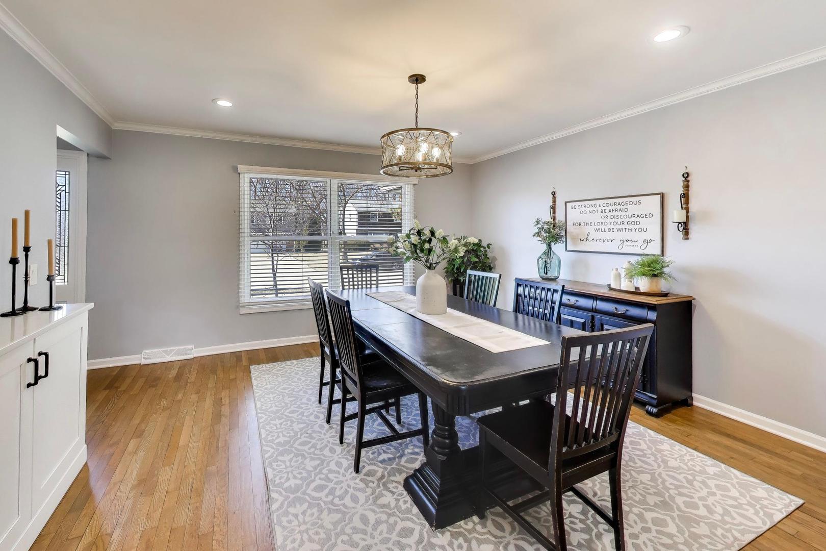1445 Stoddard Avenue Wheaton, IL 60187 - Photo 5 of 38 a view of a dining room with furniture window and wooden floor