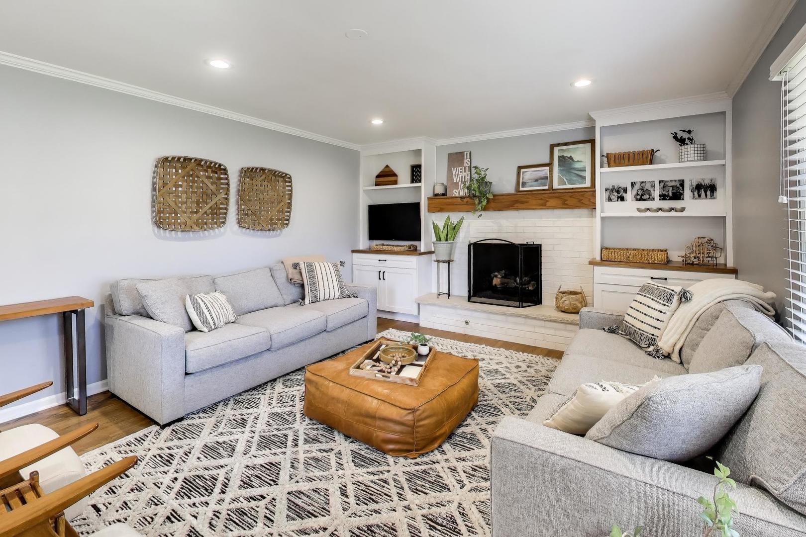 1445 Stoddard Avenue Wheaton, IL 60187 - Photo 10 of 38 a living room with furniture and a fireplace