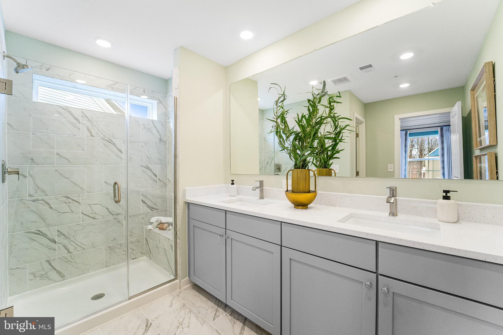 1716 Water Xing Road Baltimore, MD 21208 - Photo 13 of 21 a bathroom with a shower sink and mirror