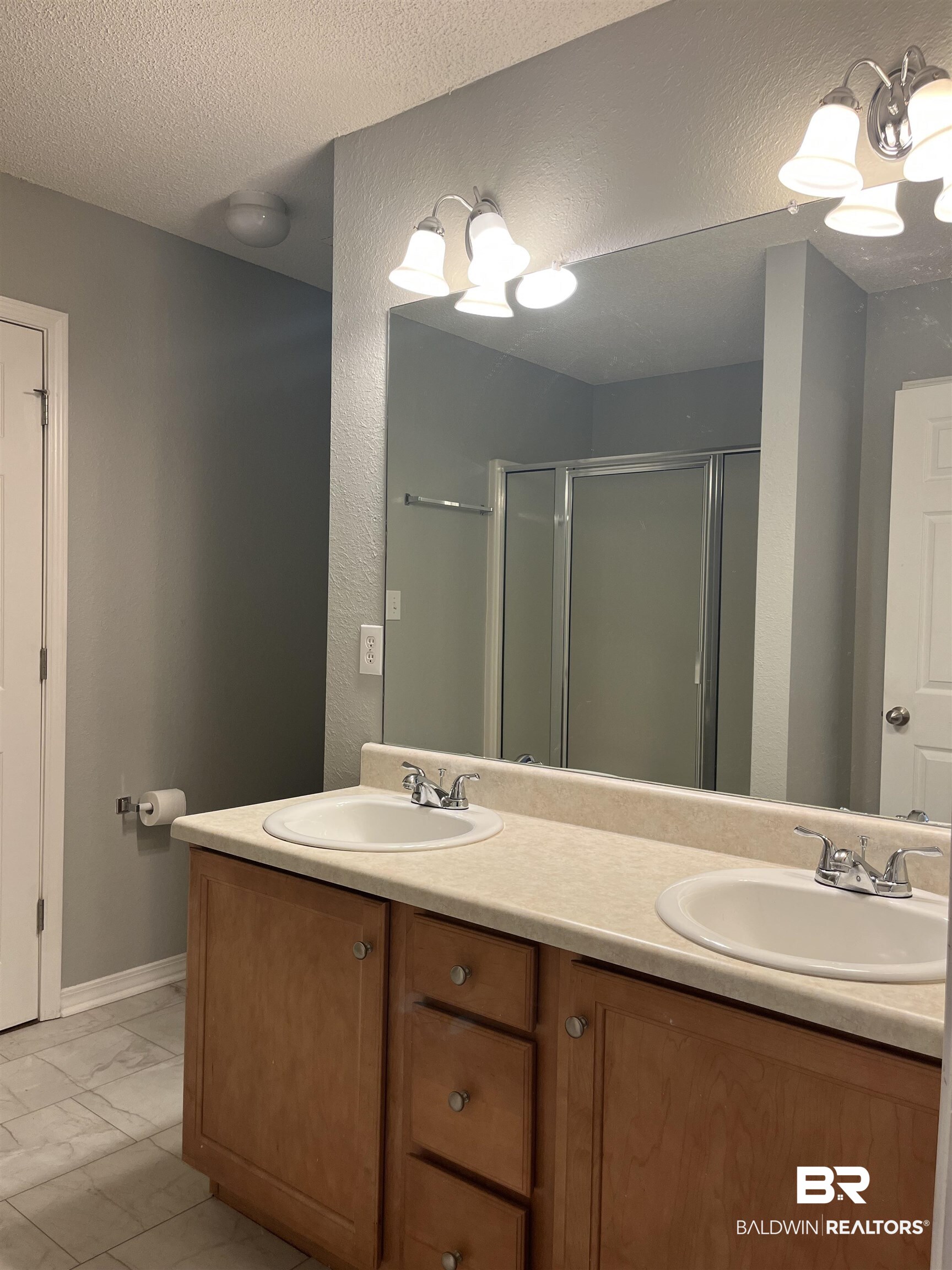 309 Cluster Street Foley, AL 36535 - Photo 14 of 38 Double vanity with two integrated sinks and chrome faucets
