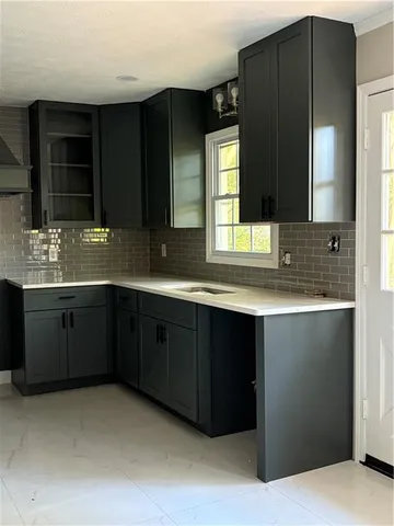 a bathroom with a double vanity sink and mirror