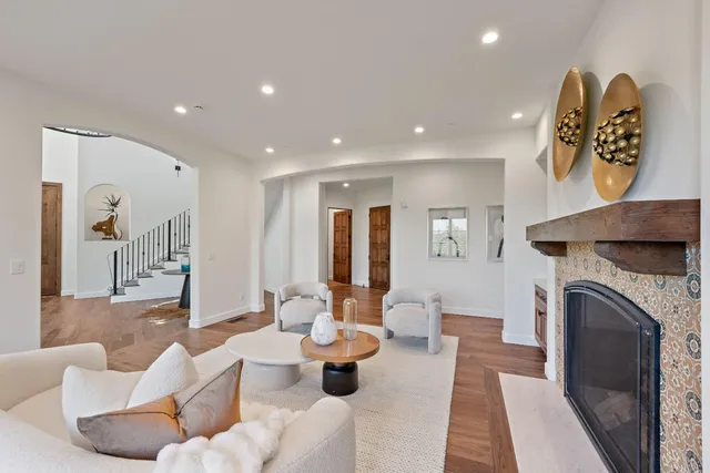 a view of a dining room with furniture wooden floor and chandelier