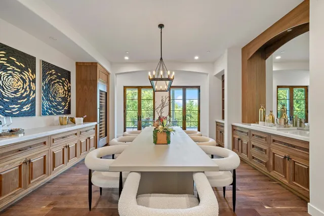 a kitchen with counter top space a sink appliances and cabinets