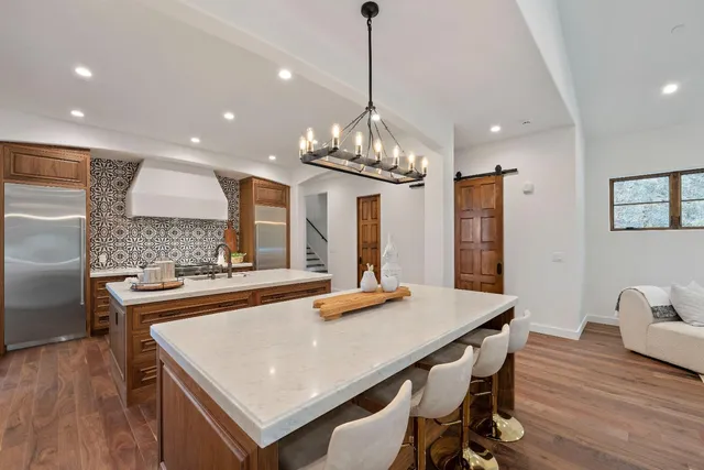 a view of a patio with table and chairs and couches