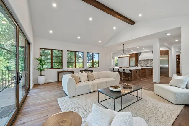 a view of a livingroom with furniture and outside view