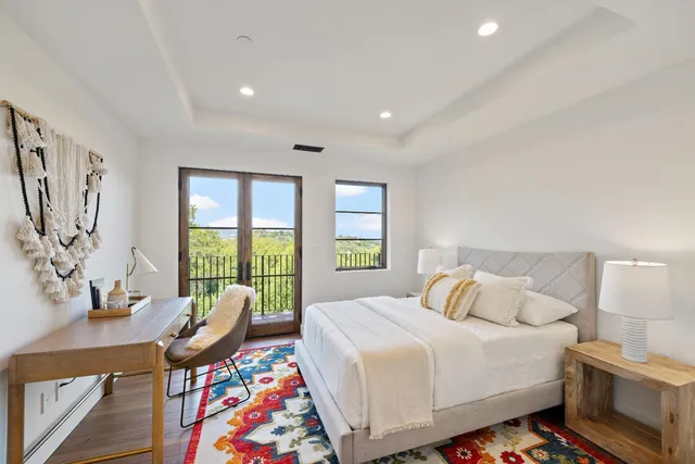 a bathroom with a tub a sink and a shower