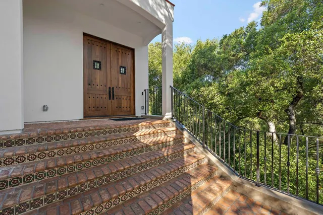 a view of an entryway with wooden floor and windows