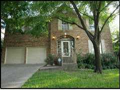 6009 Tributary Ridge Drive Austin, TX 78759 - Photo 1 of 1 a front view of a house with a yard