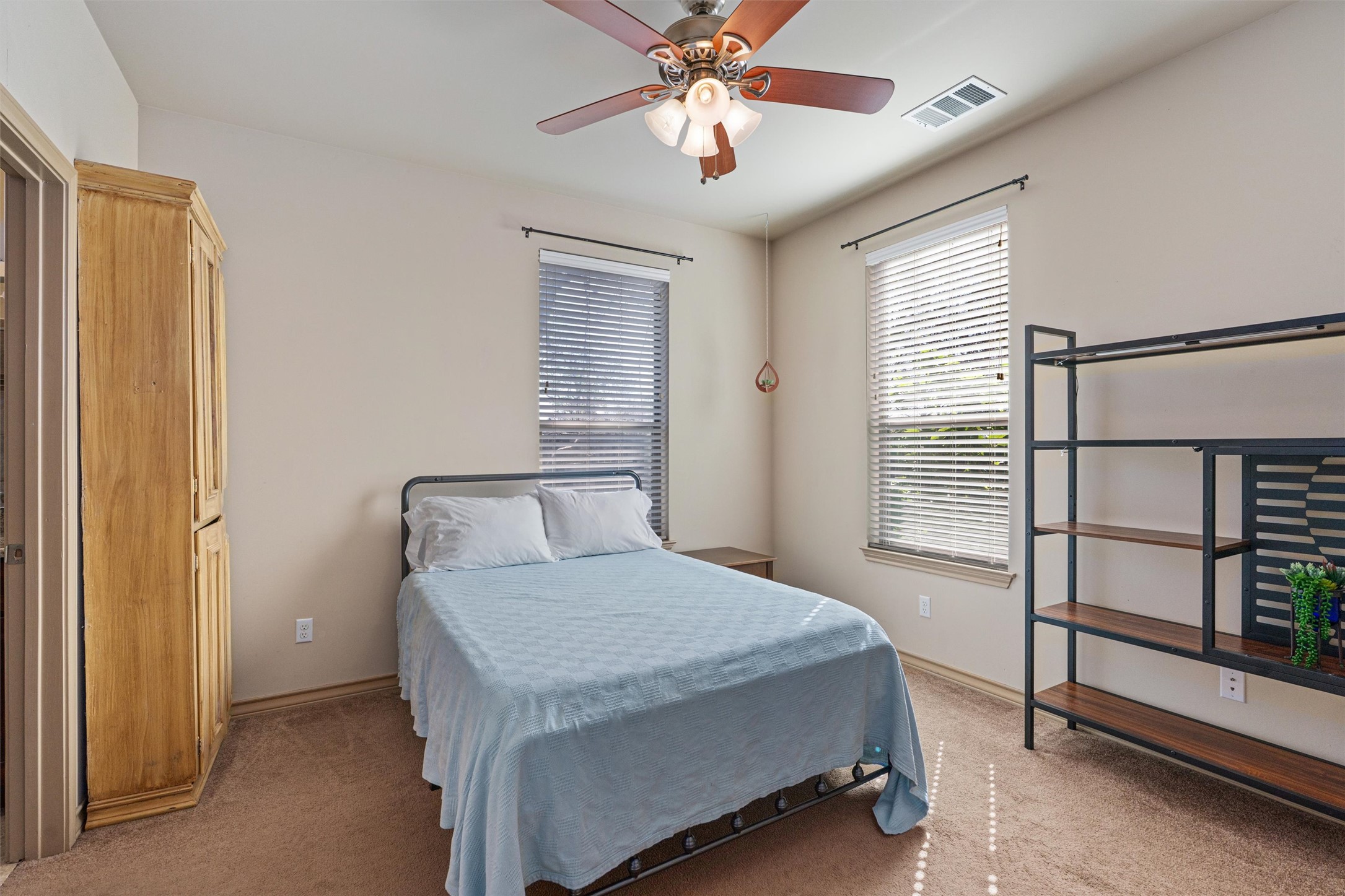 209 Harris Street Elgin, TX 78621 - Photo 12 of 40 Bedroom featuring a ceiling fan and carpet flooring