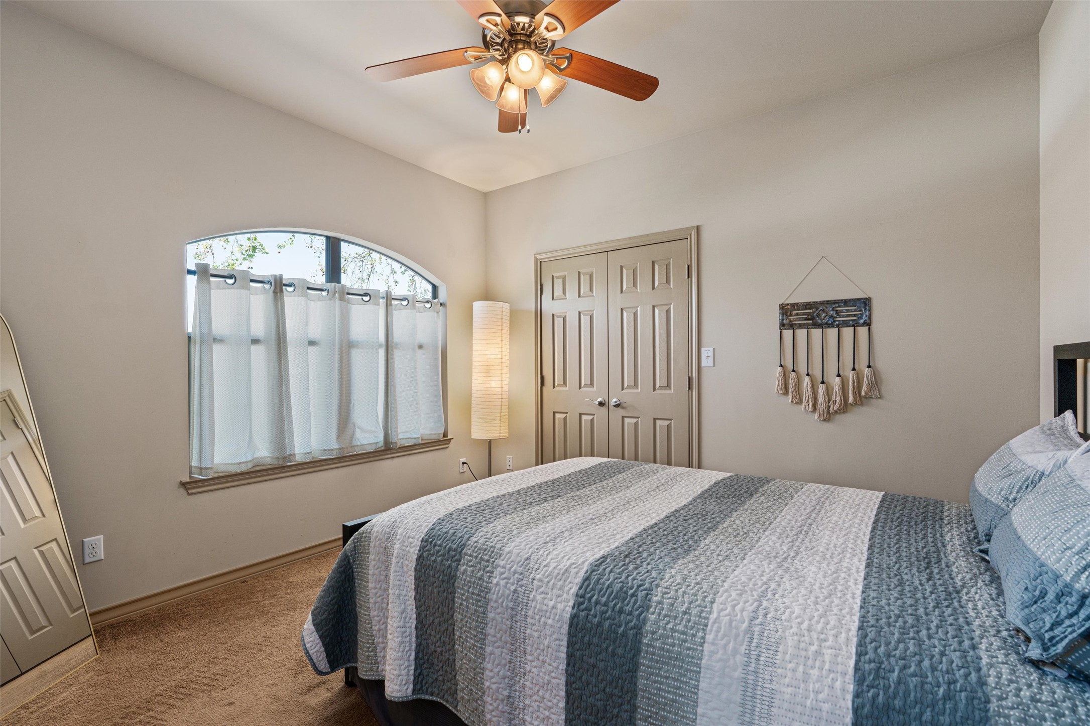 209 Harris Street Elgin, TX 78621 - Photo 20 of 40 Bedroom with a closet, ceiling fan, and carpet flooring