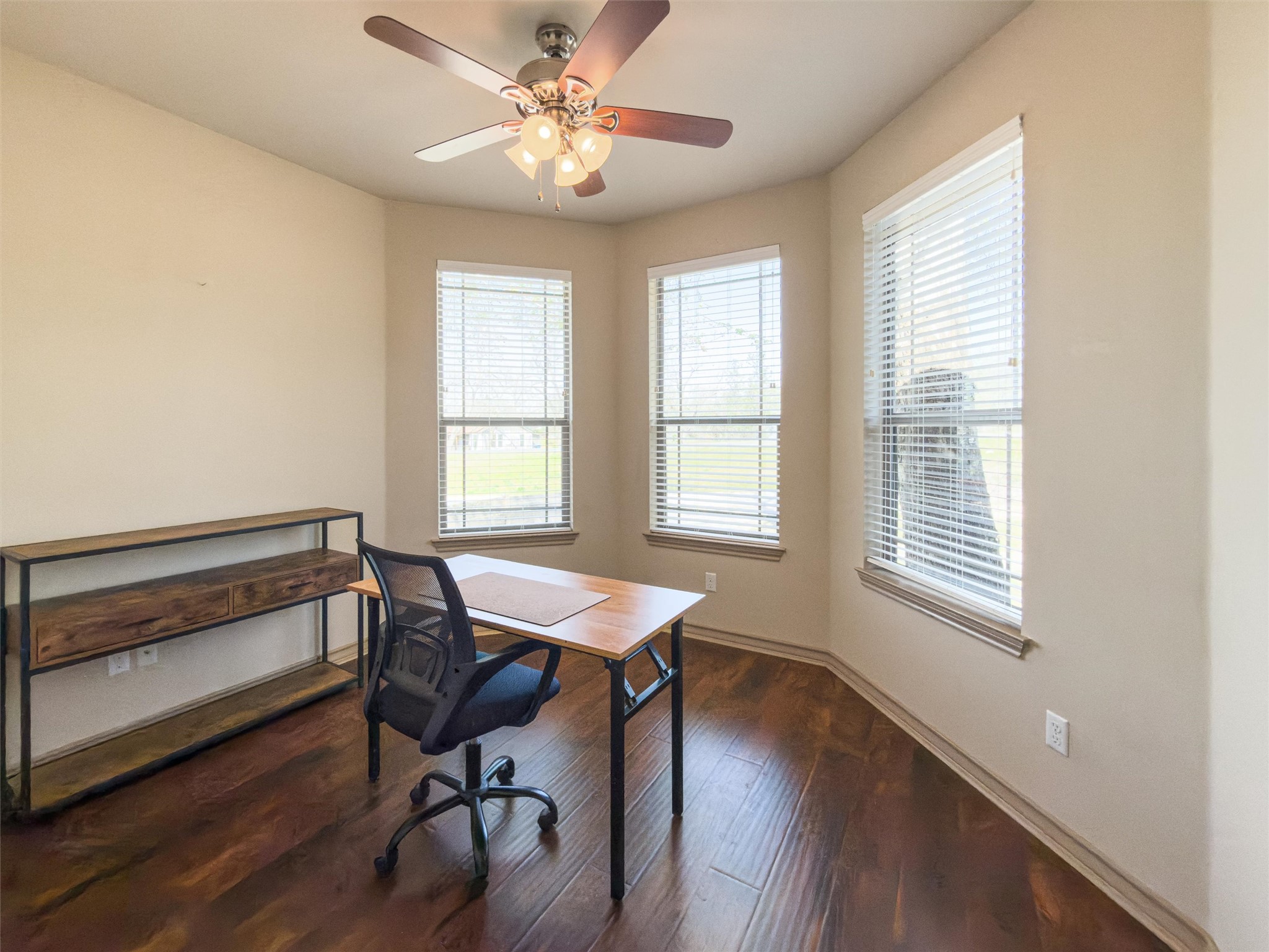209 Harris Street Elgin, TX 78621 - Photo 22 of 40 Office area with dark wood-style floors and ceiling fan