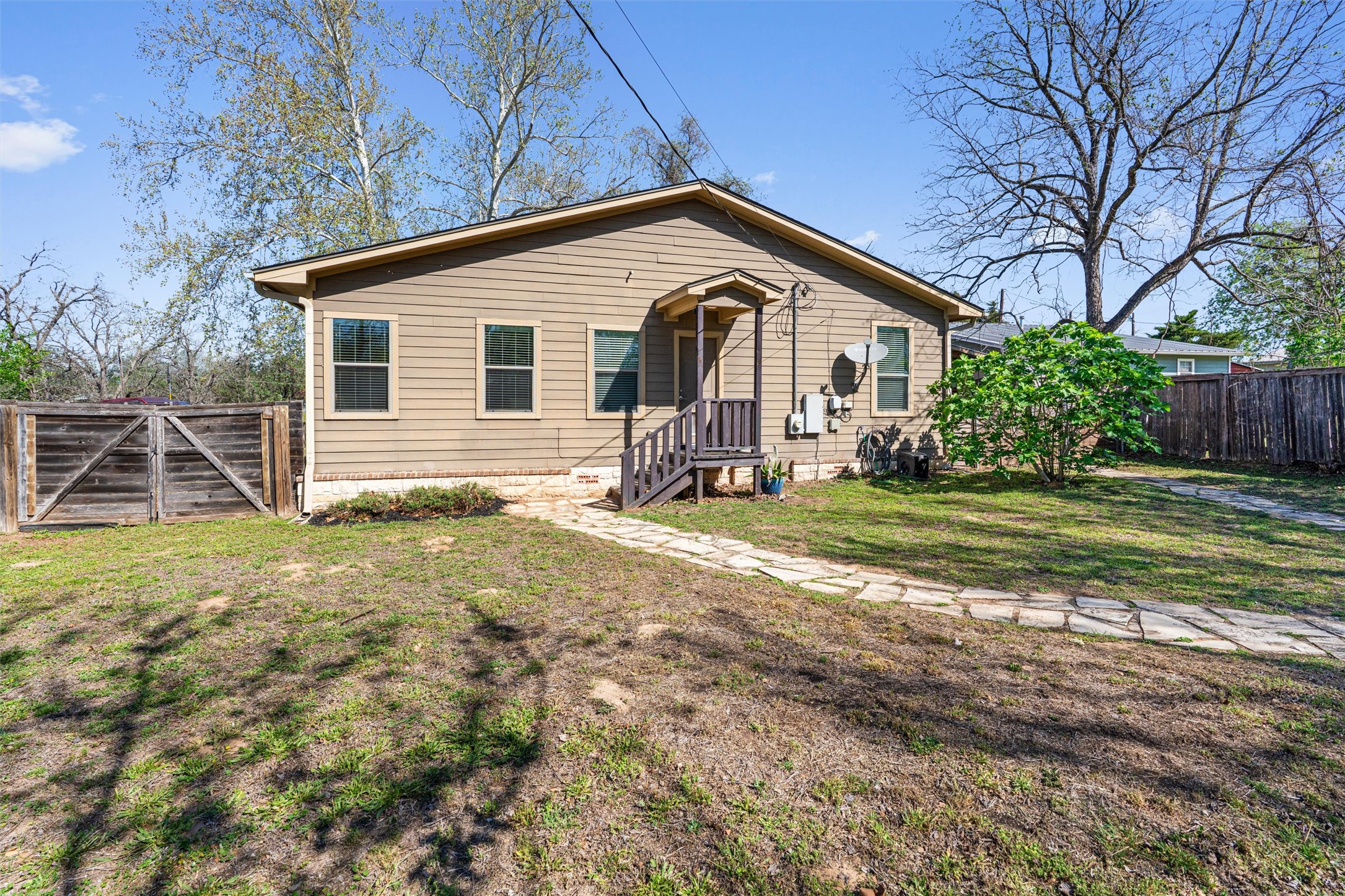 209 Harris Street Elgin, TX 78621 - Photo 25 of 40 View of front of home with a fenced backyard and a gate