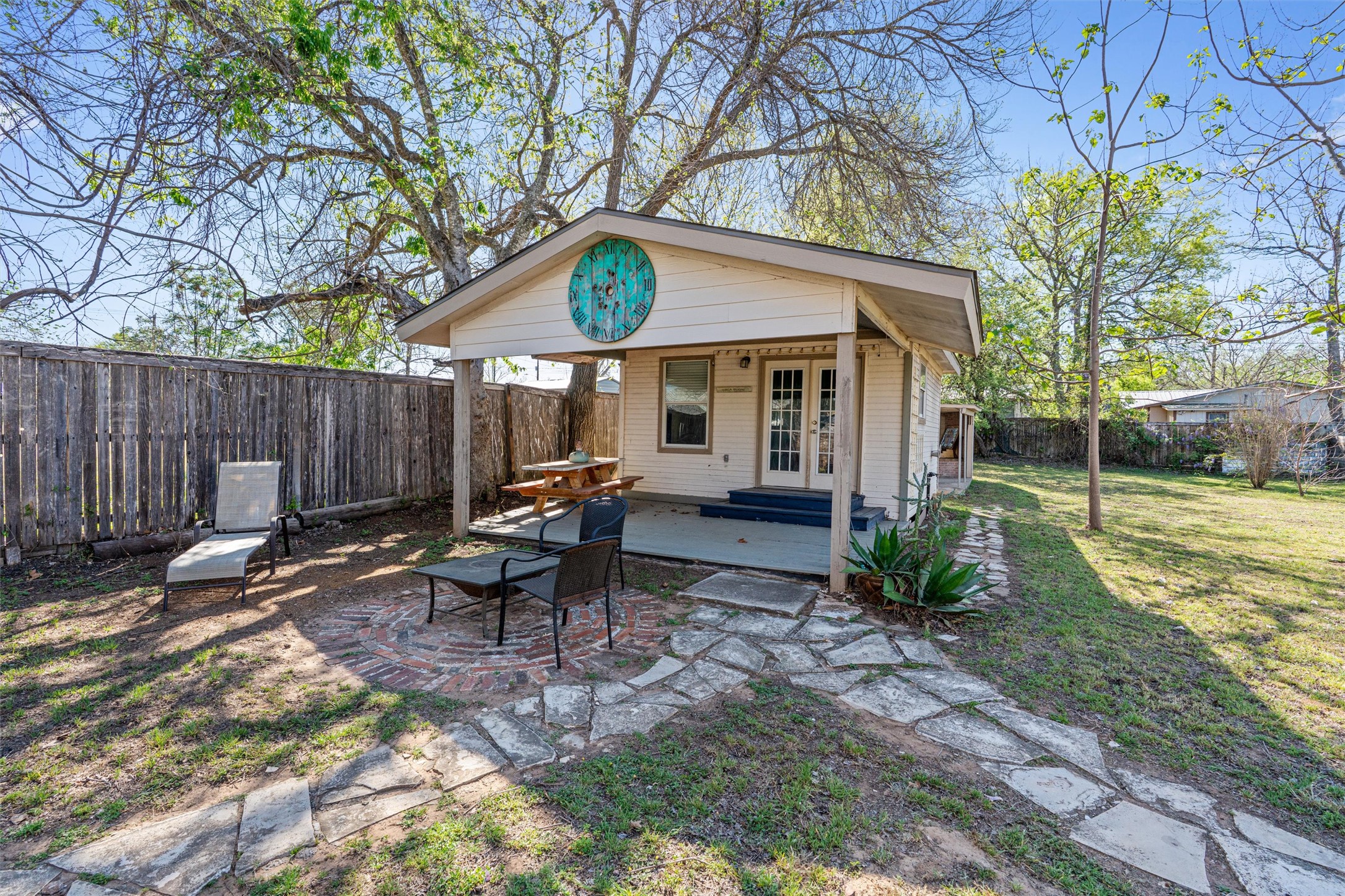 209 Harris Street Elgin, TX 78621 - Photo 26 of 40 Front of studio with french doors and a patio