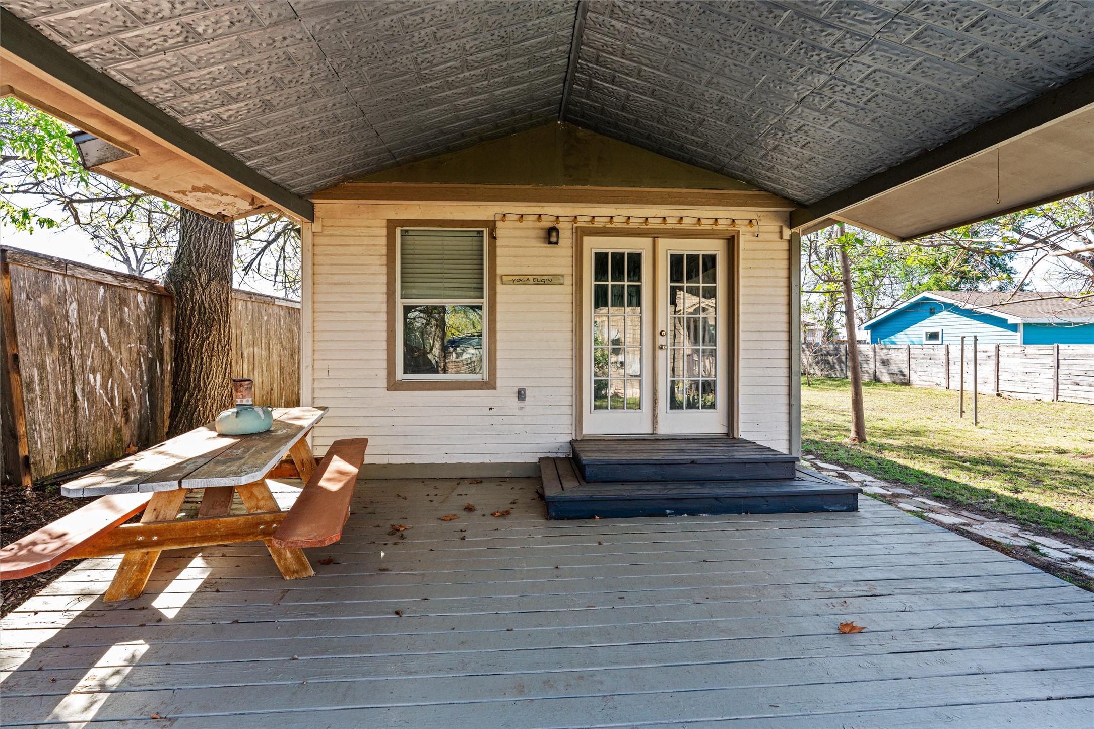 209 Harris Street Elgin, TX 78621 - Photo 27 of 40 Wooden deck with french doors