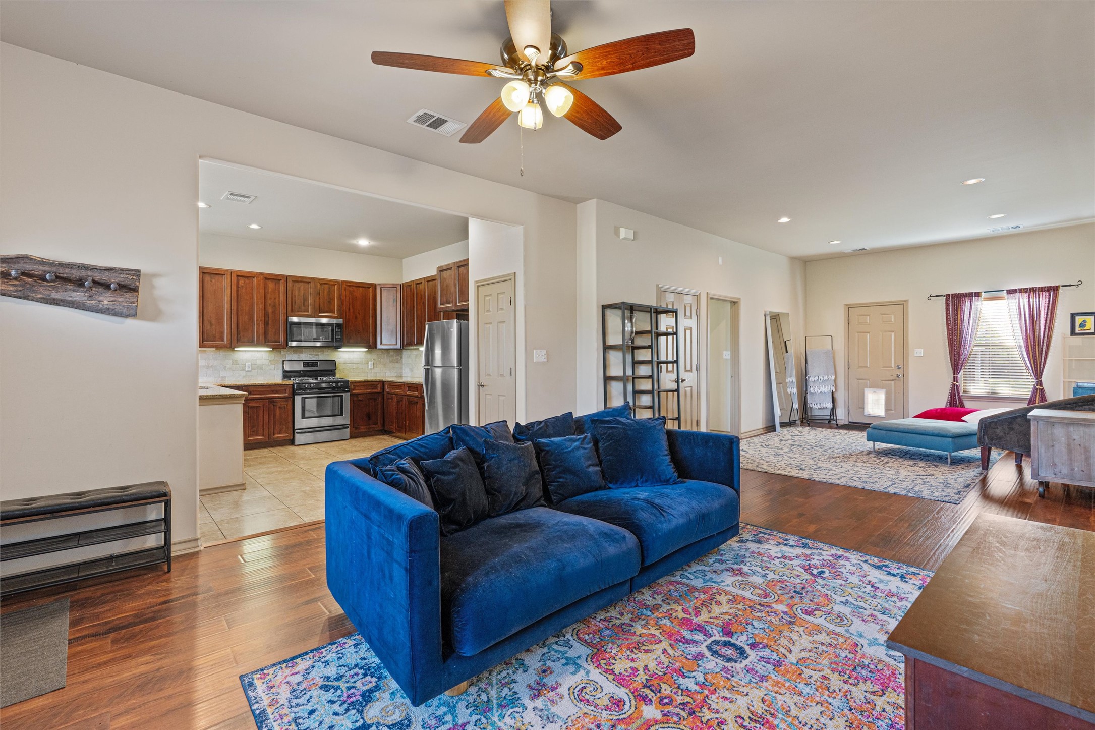 209 Harris Street Elgin, TX 78621 - Photo 4 of 40 Living area featuring light wood-type flooring, ceiling fan, and recessed lighting