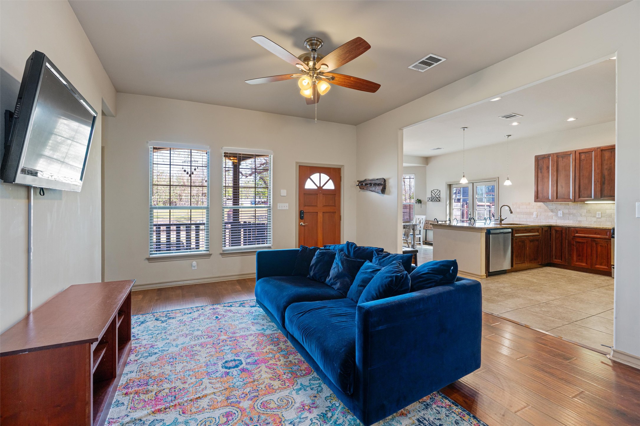 209 Harris Street Elgin, TX 78621 - Photo 5 of 40 Living room featuring light wood-type flooring and a ceiling fan