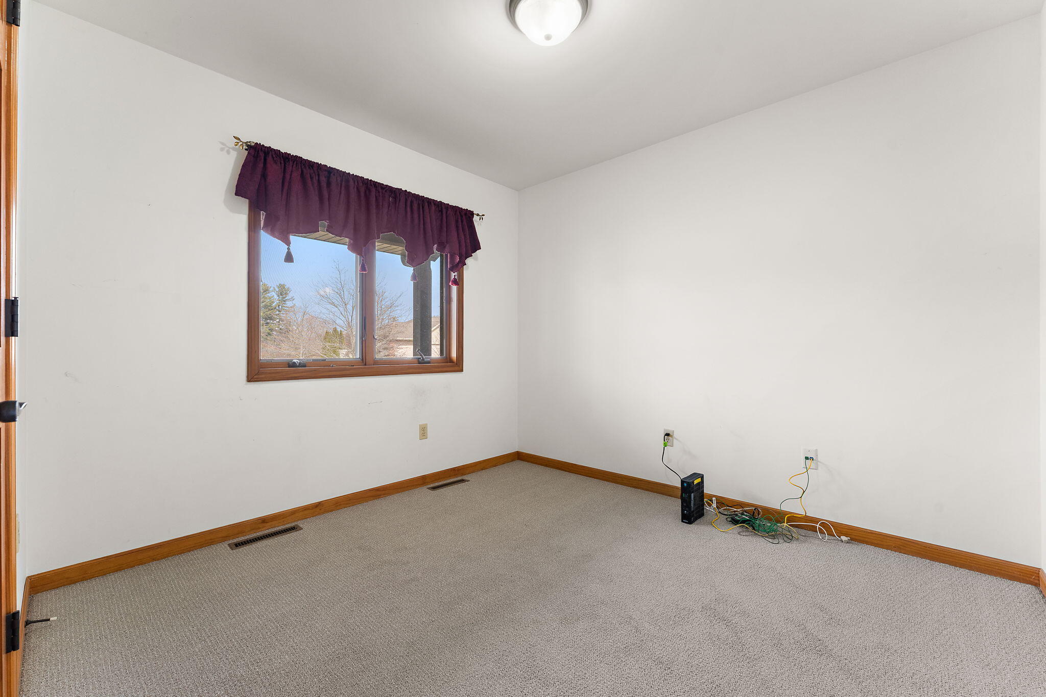 5005 West 152nd Court Crown Point, IN 46307 - Photo 12 of 22 an empty room with windows and air conditioner