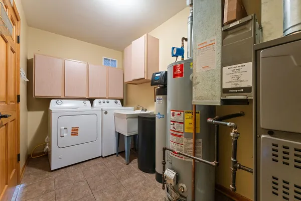 a bathroom with a sink a toilet and a shower