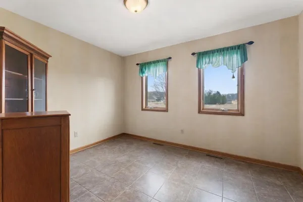 a balcony with furniture and view of kitchen