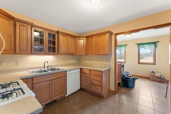 a kitchen with a sink and cabinets