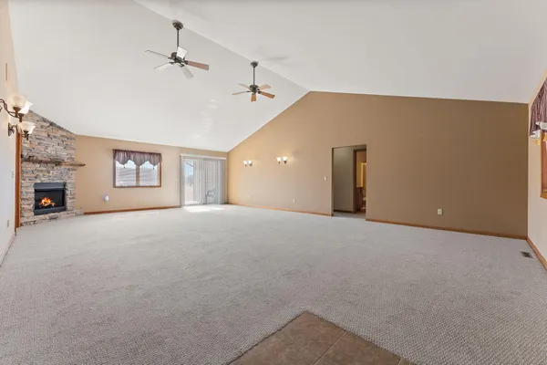 an empty room with windows and closet