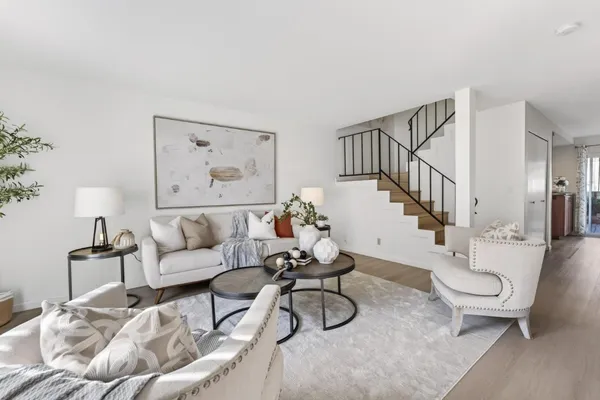 a living room with furniture and a table