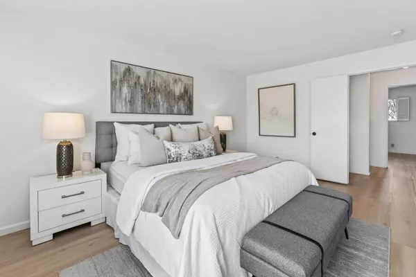 a bedroom with a bed and a couch