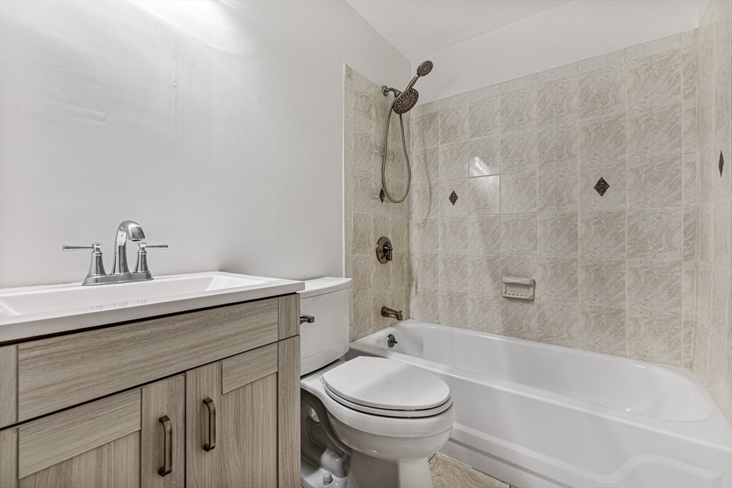 431 Columbus Avenue, Unit 4 Boston, MA 02116 - Photo 20 of 27 a bathroom with a sink a toilet and shower
