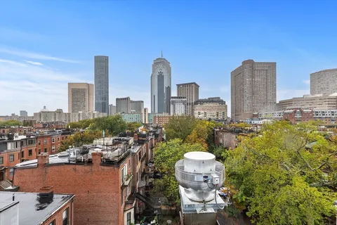 a view of a city with tall buildings