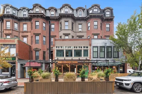 a view of a building on a street