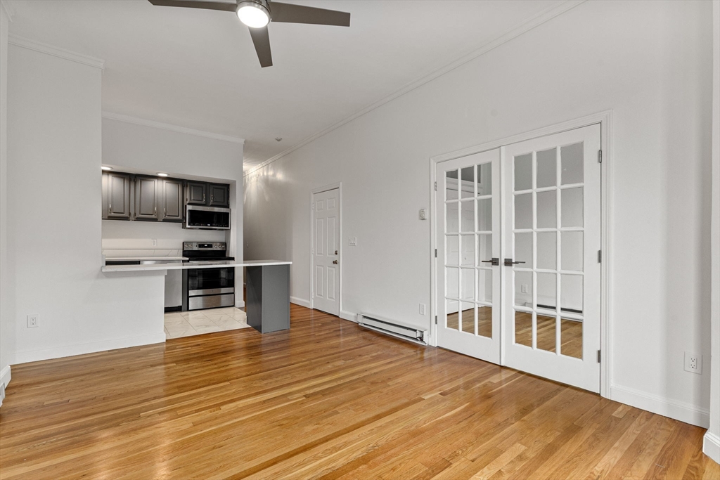 431 Columbus Avenue, Unit 4 Boston, MA 02116 - Photo 4 of 27 a view of kitchen with furniture and wooden floor