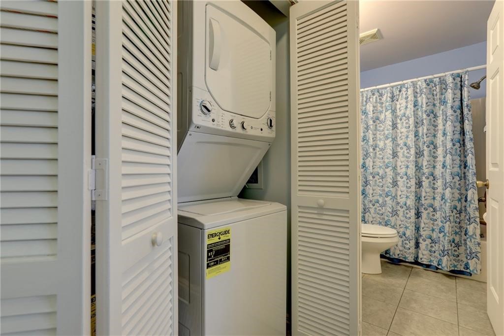 9635 Riverside Drive, Unit 4 Sebastian, FL 32958 - Photo 26 of 36 a utility room with dryer and washer