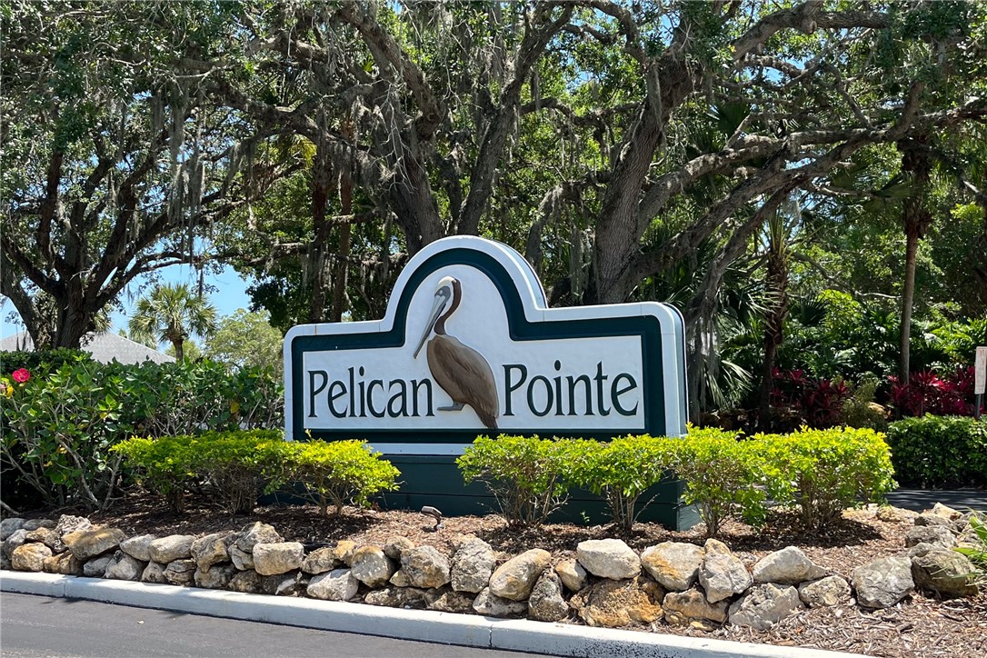 9635 Riverside Drive, Unit 4 Sebastian, FL 32958 - Photo 33 of 36 a sign that is sitting in front of flowers