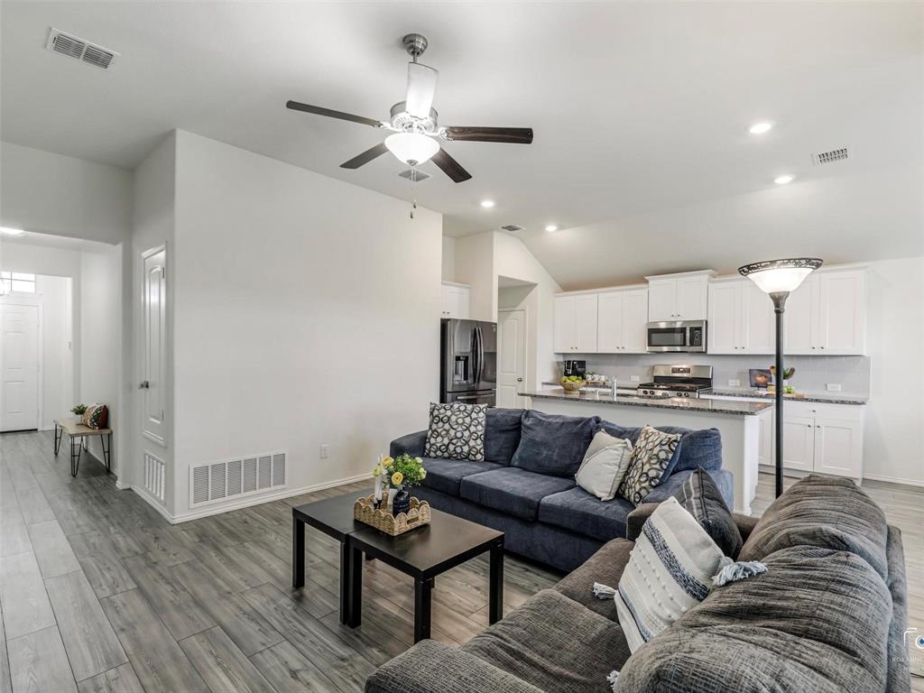 4517 Ashmark Road Aubrey, TX 76227 - Photo 26 of 26 a living room with furniture and kitchen view