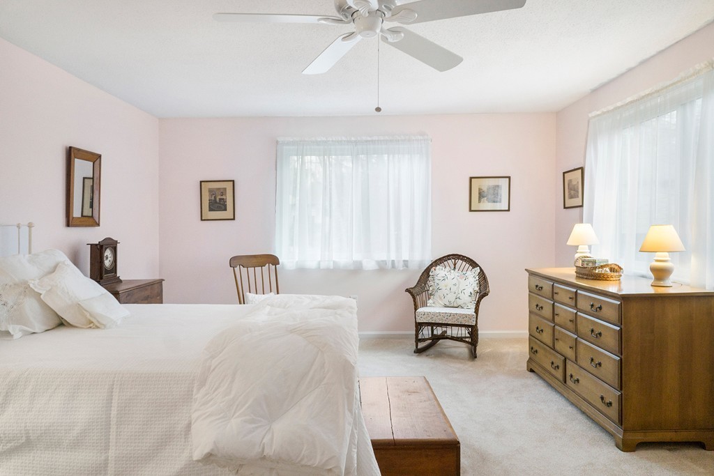 82 Meeting House Path, Unit 82 Ashland, MA 01721 - Photo 11 of 23 a bedroom with a bed window and couch