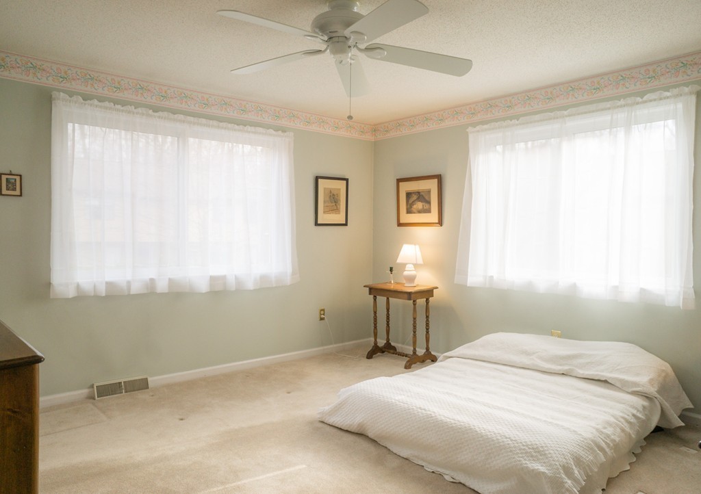82 Meeting House Path, Unit 82 Ashland, MA 01721 - Photo 15 of 23 a bedroom with a bed and a window