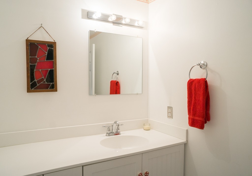 82 Meeting House Path, Unit 82 Ashland, MA 01721 - Photo 10 of 23 a bathroom with a sink and a mirror