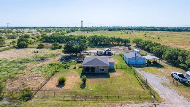 a view of a lake with a yard