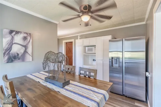 a bed room with a bed and a chandelier