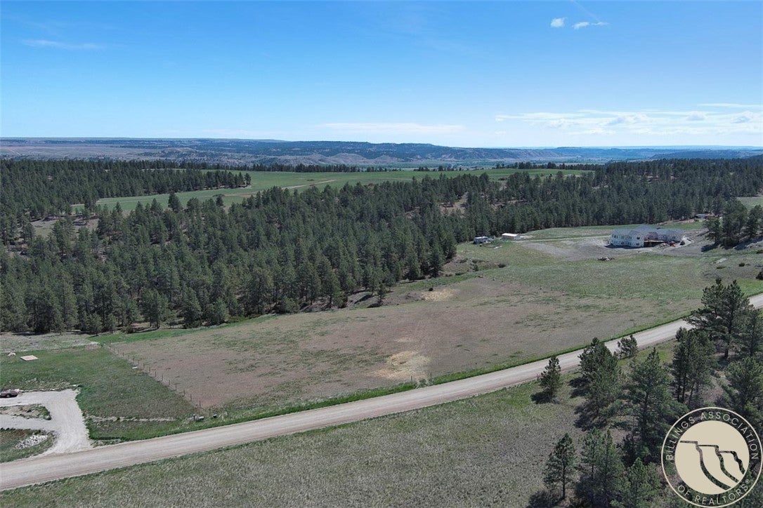 Lot 2 Shane Ridge Road Columbus, MT 59019 - Photo 1 of 20 Beautiful level pasture area offering an ideal setting for your future dream home with peaceful country surroundings.
Aerial overview of lot 2 from front (south west side) to back (north east side) and the surrounding subdivision.