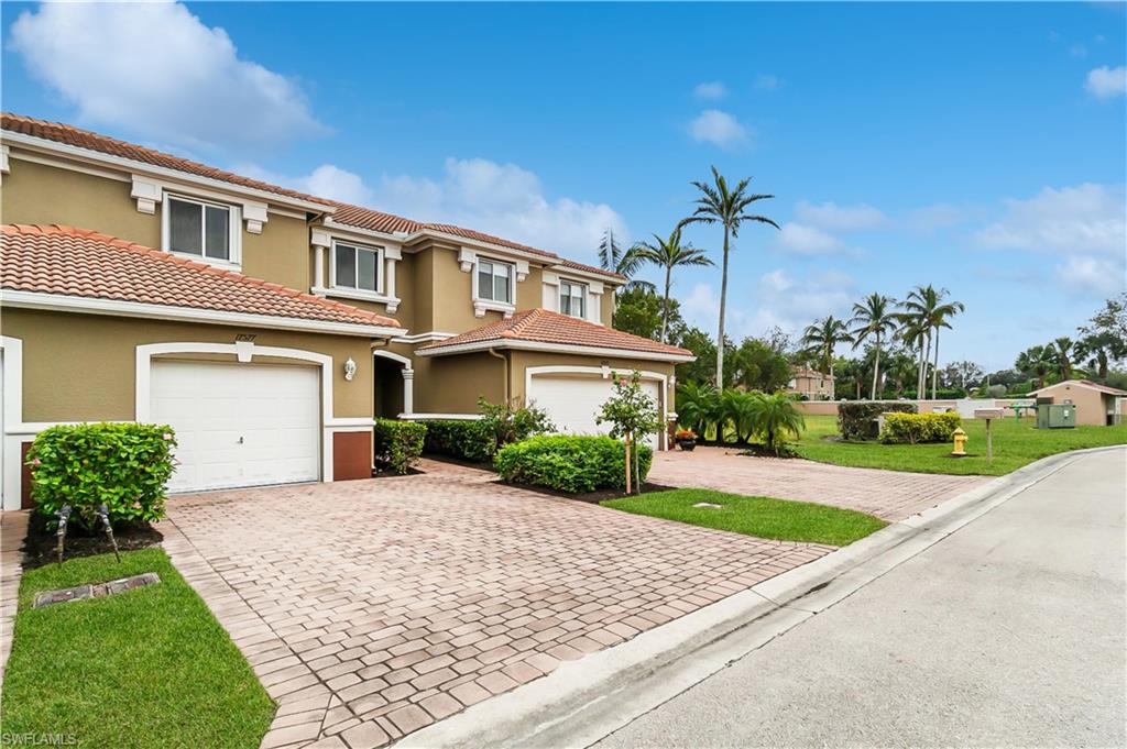 17577 Brickstone Loop Fort Myers, FL 33967 - Photo 1 of 33 a front view of a house with a yard and garage