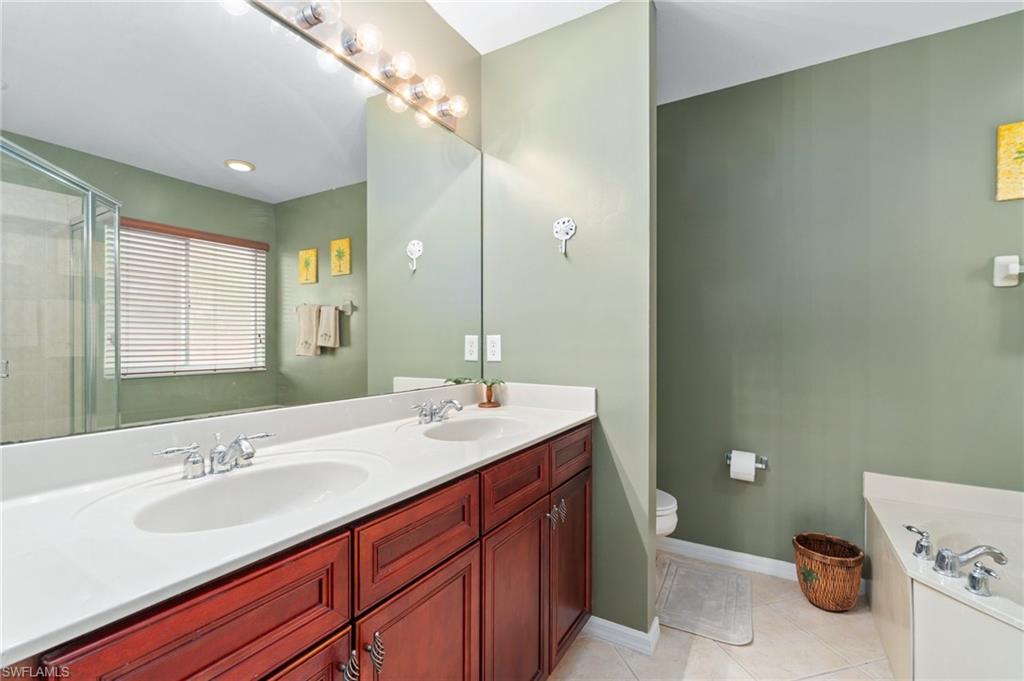 17577 Brickstone Loop Fort Myers, FL 33967 - Photo 15 of 33 a bathroom with a sink and a mirror