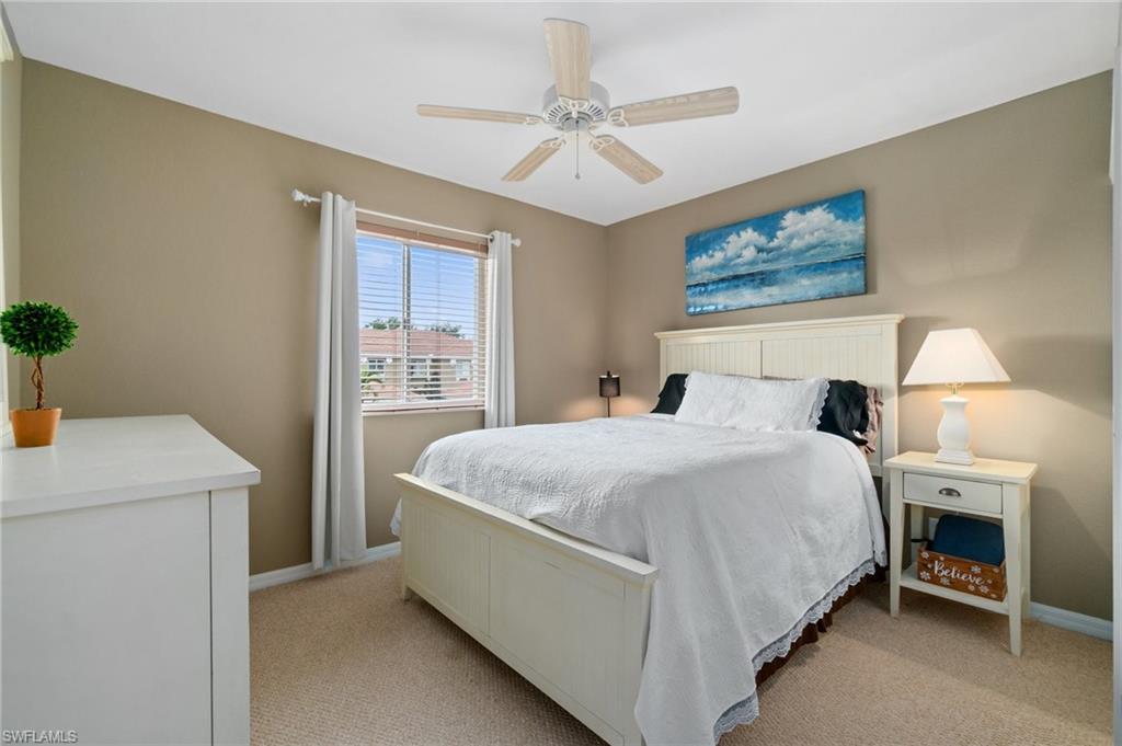 17577 Brickstone Loop Fort Myers, FL 33967 - Photo 19 of 33 a bedroom with a bed and a table