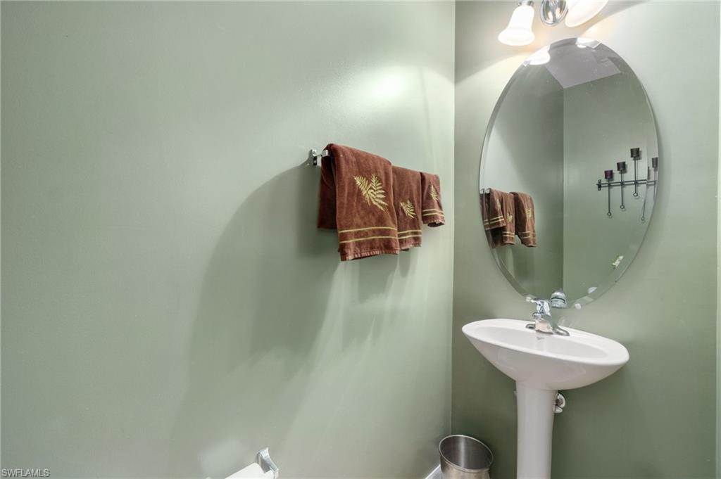 17577 Brickstone Loop Fort Myers, FL 33967 - Photo 24 of 33 a bathroom with a sink and a mirror
